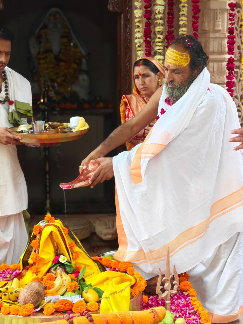 Devotees taking part in puja
